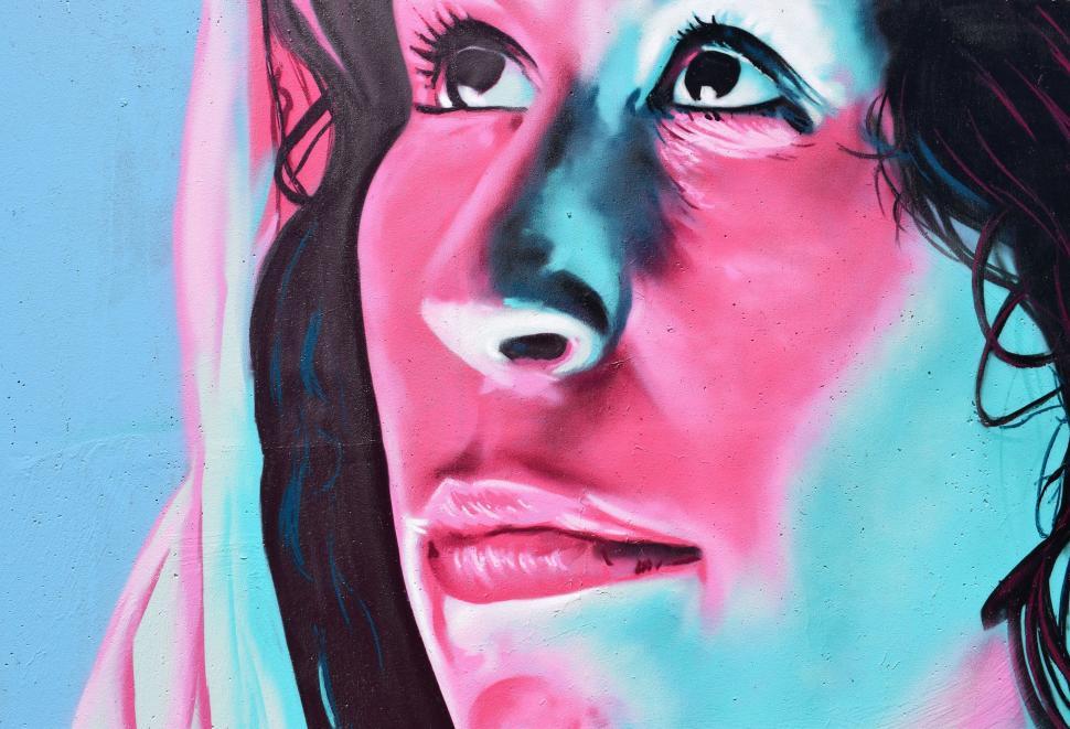 Free Image of Womans Face Painting on Wall 