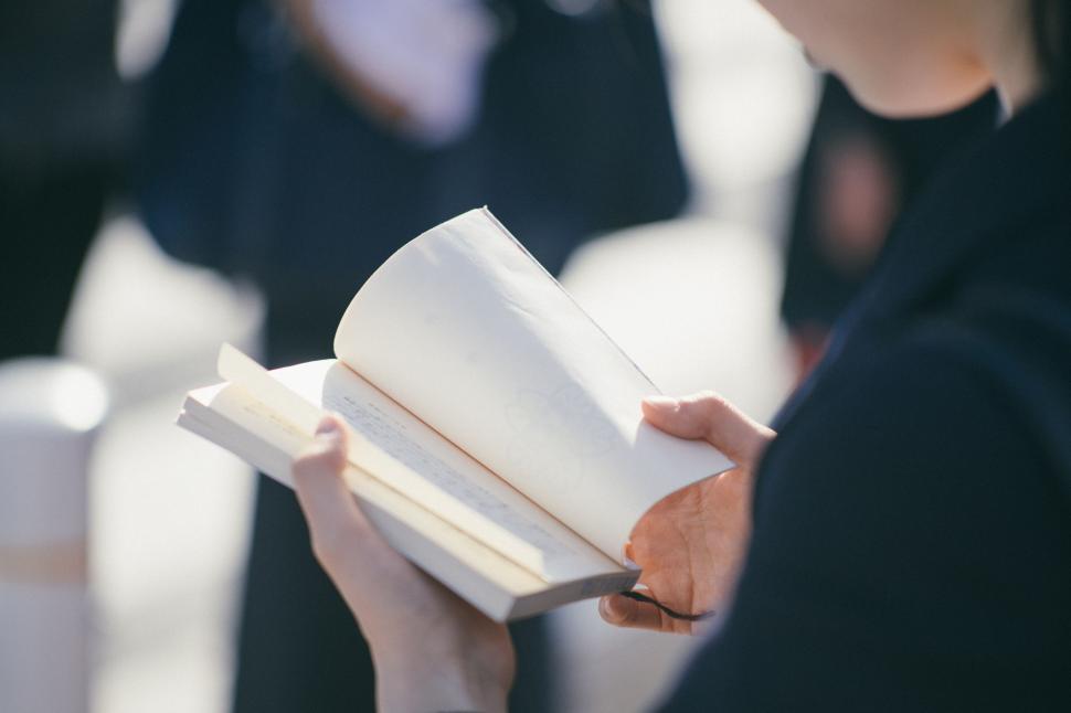 Free Image of Woman Holding a Book 