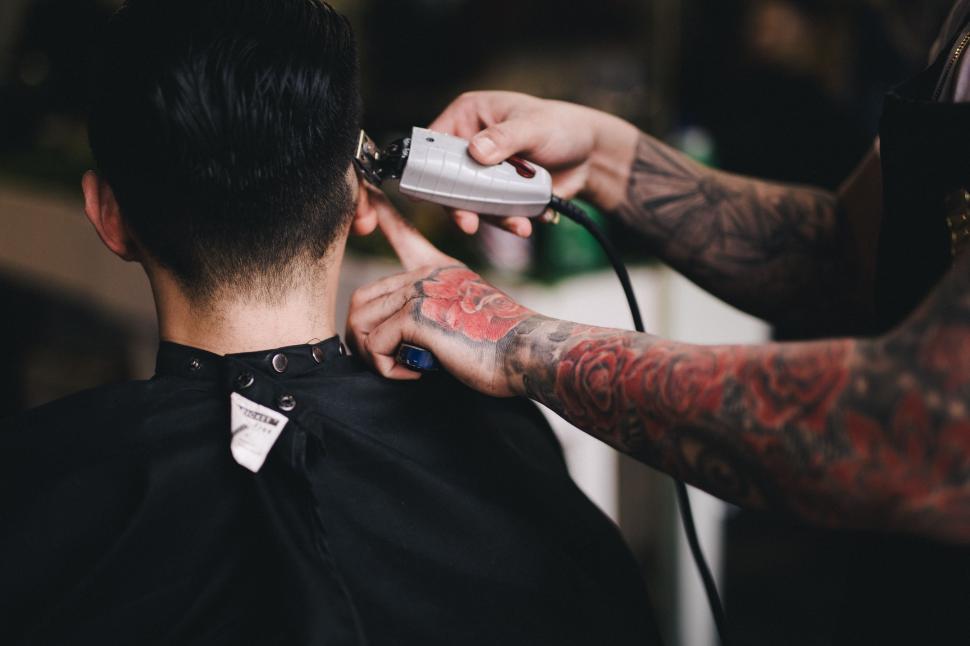 Free Image of Man Getting Haircut at Barber Shop 