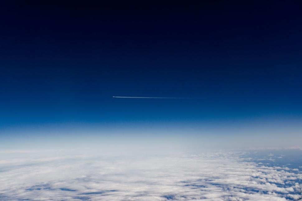 Free Image of Airplane Flying High Above Clouds 