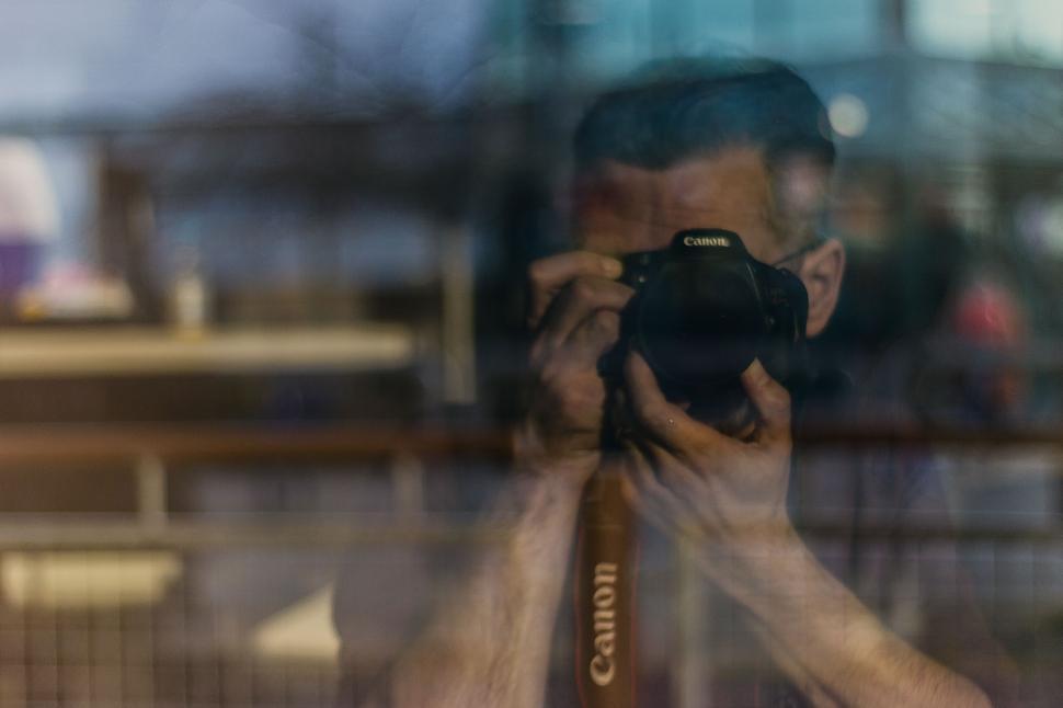 Free Image of Man Taking a Selfie With a Camera 