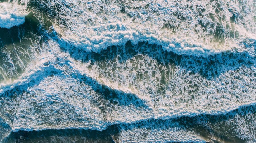 Free Image of Aerial View of Blue and White Wave Pattern 