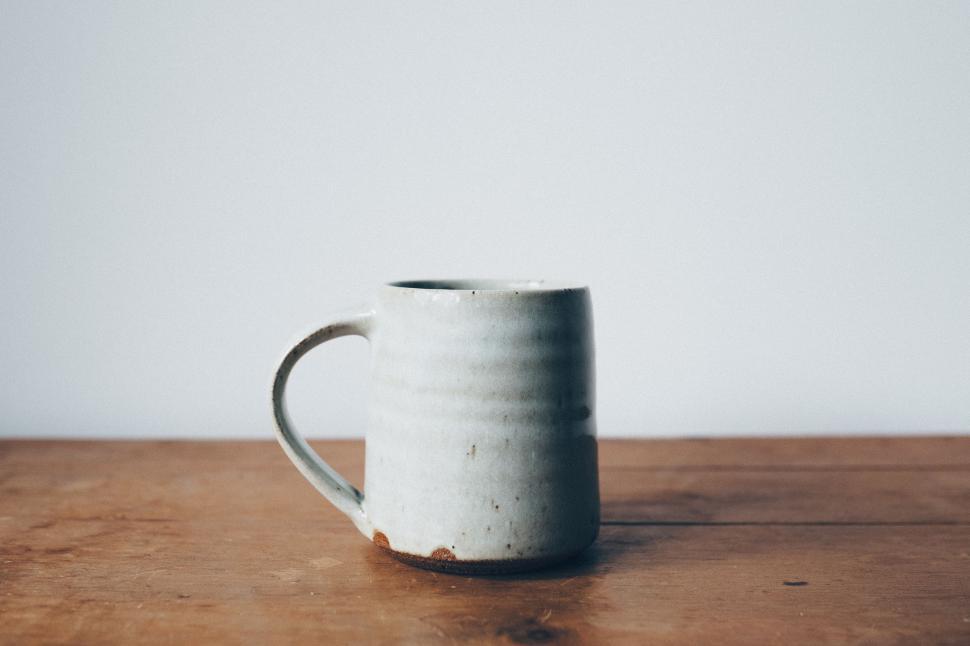 Free Image of White Cup on Wooden Table 