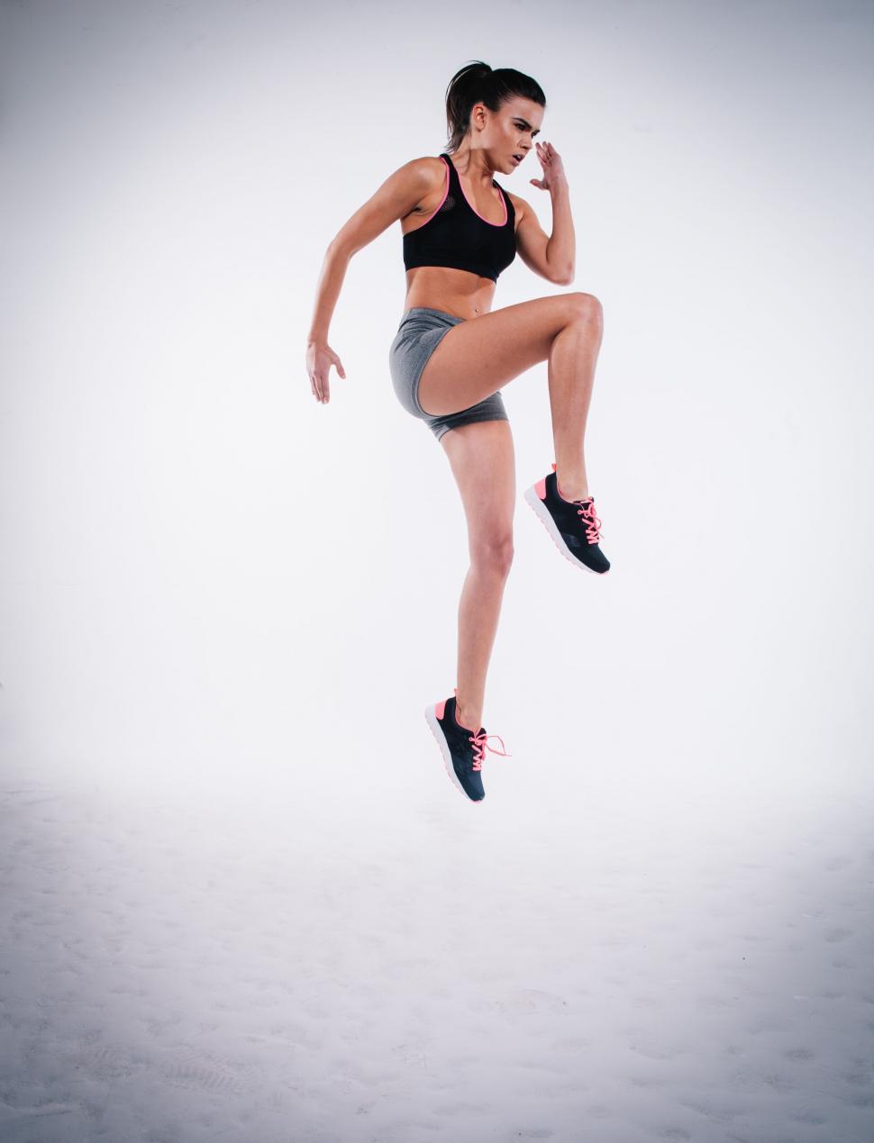 Free Image of Woman in Black Top and Grey Shorts 