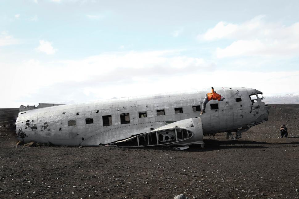 Free Image of Old Airplane Resting on Dirt Field 