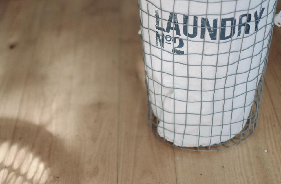 Free Image of White Trash Can on Wooden Floor 