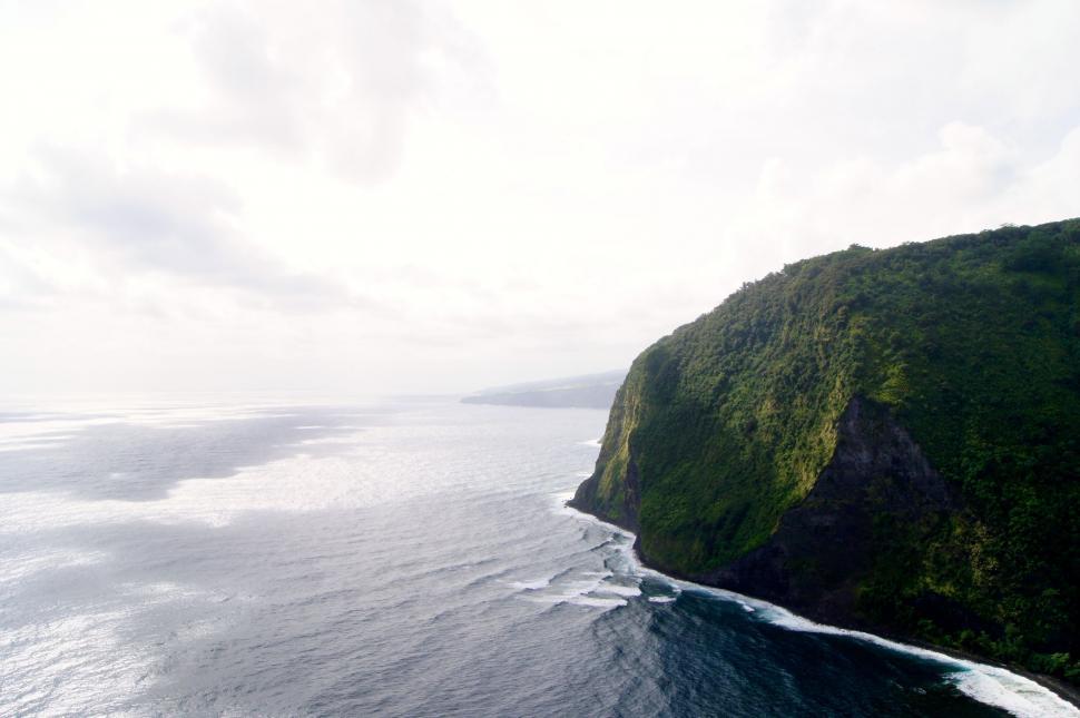 Free Image of Cliff Overlooking Vast Water Formation 
