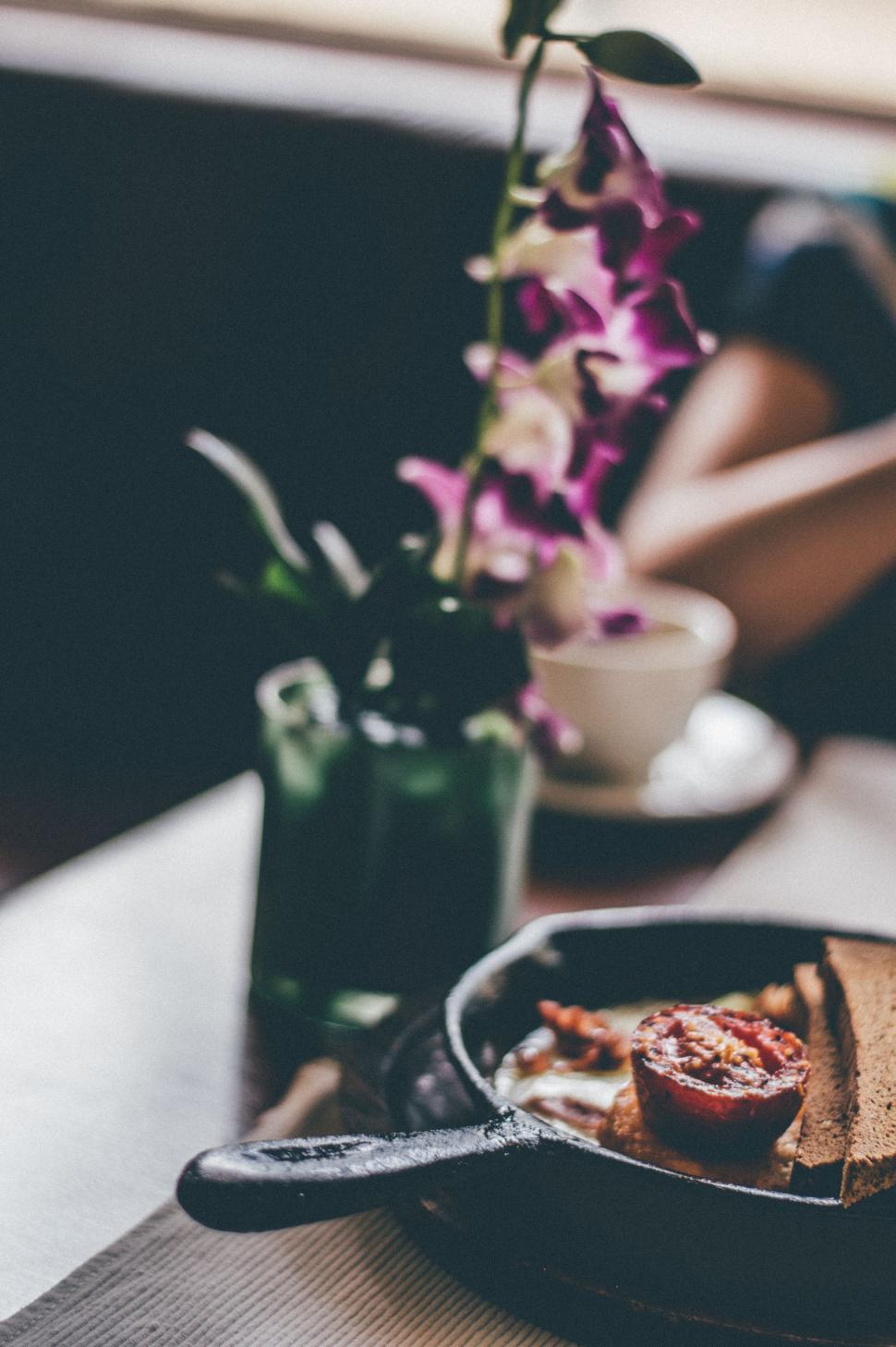 Free Image of A Pan of Food on Wooden Table 