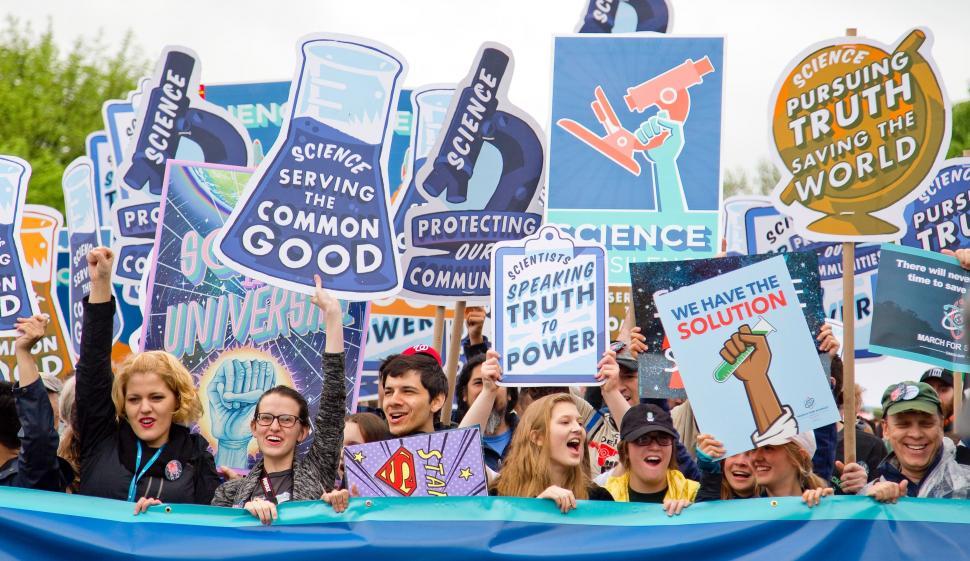 Free Image of Large Group of People Holding Up Signs 