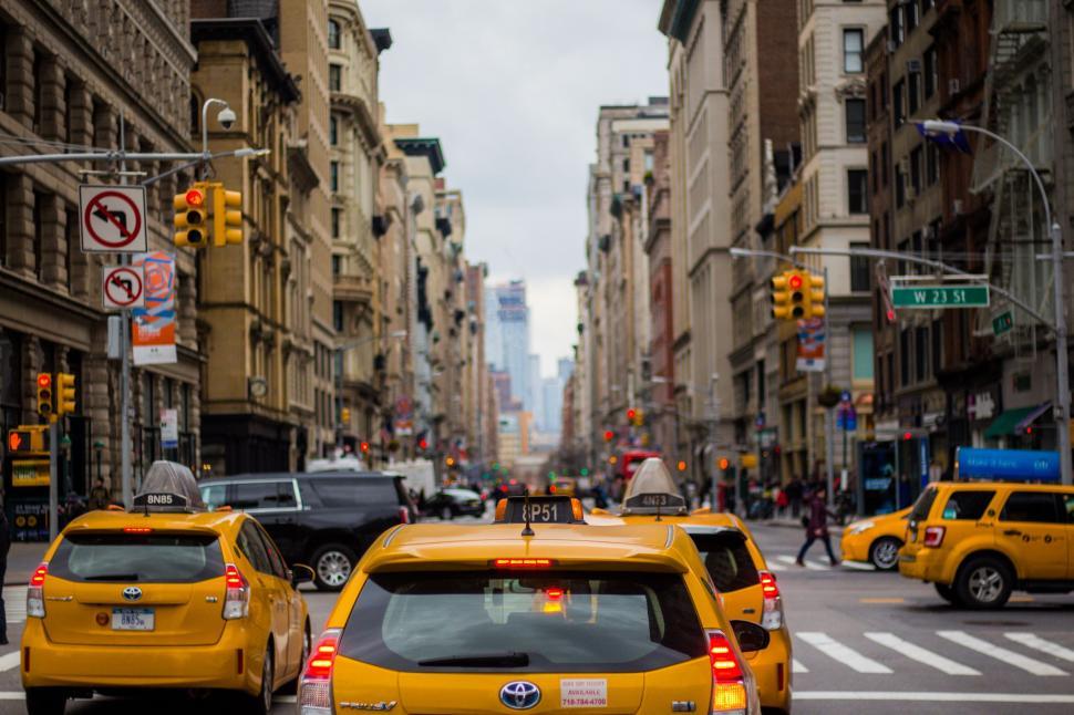 Free Image of Busy City Street With Heavy Traffic and Tall Buildings 
