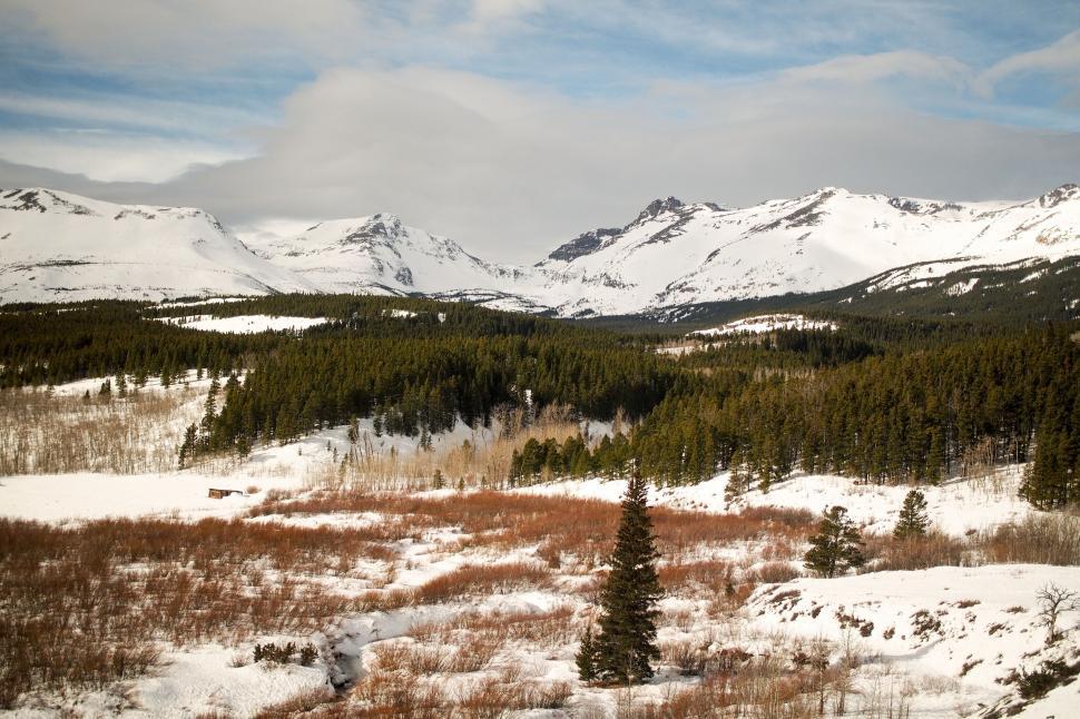 Free Image of Snowboarder Descending Snowy Hill 