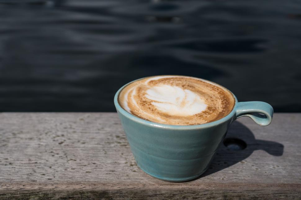 Free Image of A Cup of Coffee on Wooden Table 