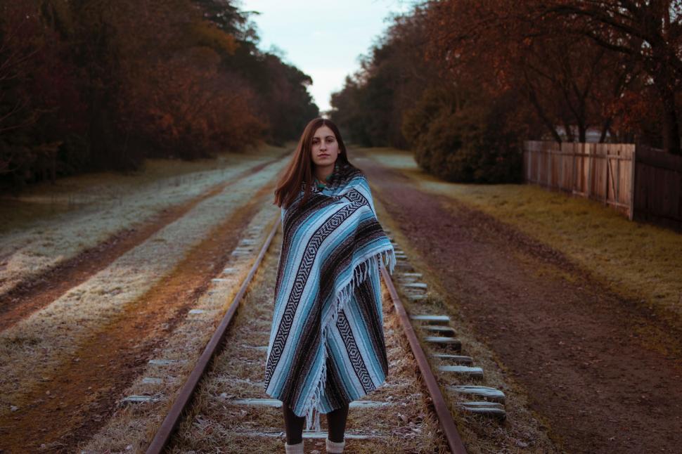 Free Image of Woman Standing on Train Track 
