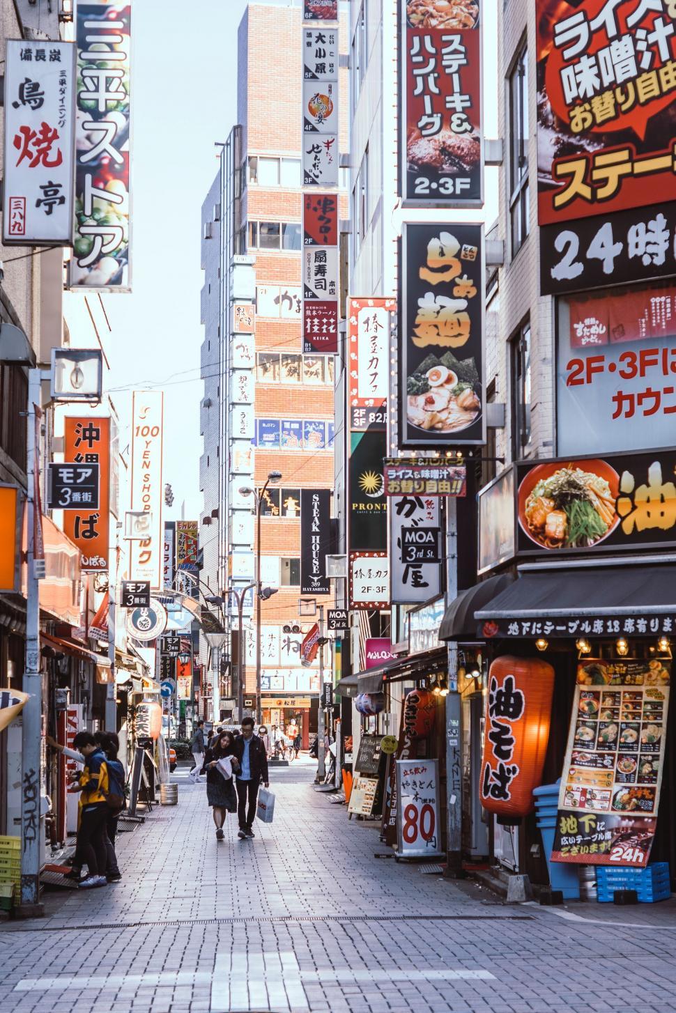 Free Image of Busy City Street With Pedestrians Walking 