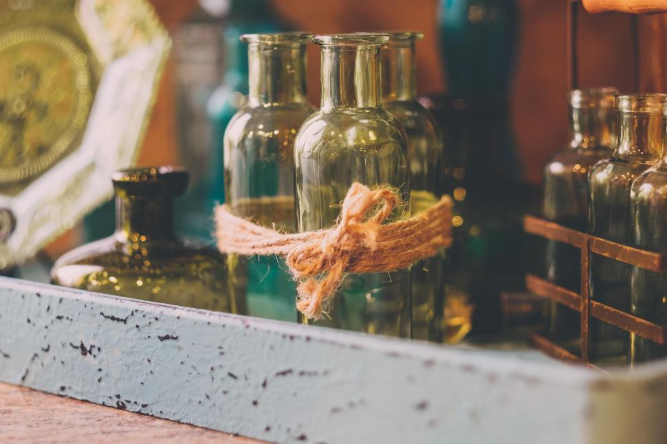 Free Image of Shelf With Bottles and Clock 