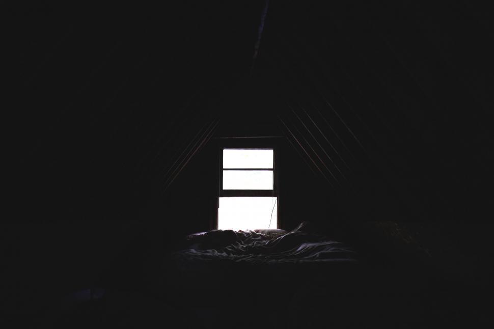 Free Image of Bed in a Dark Room 