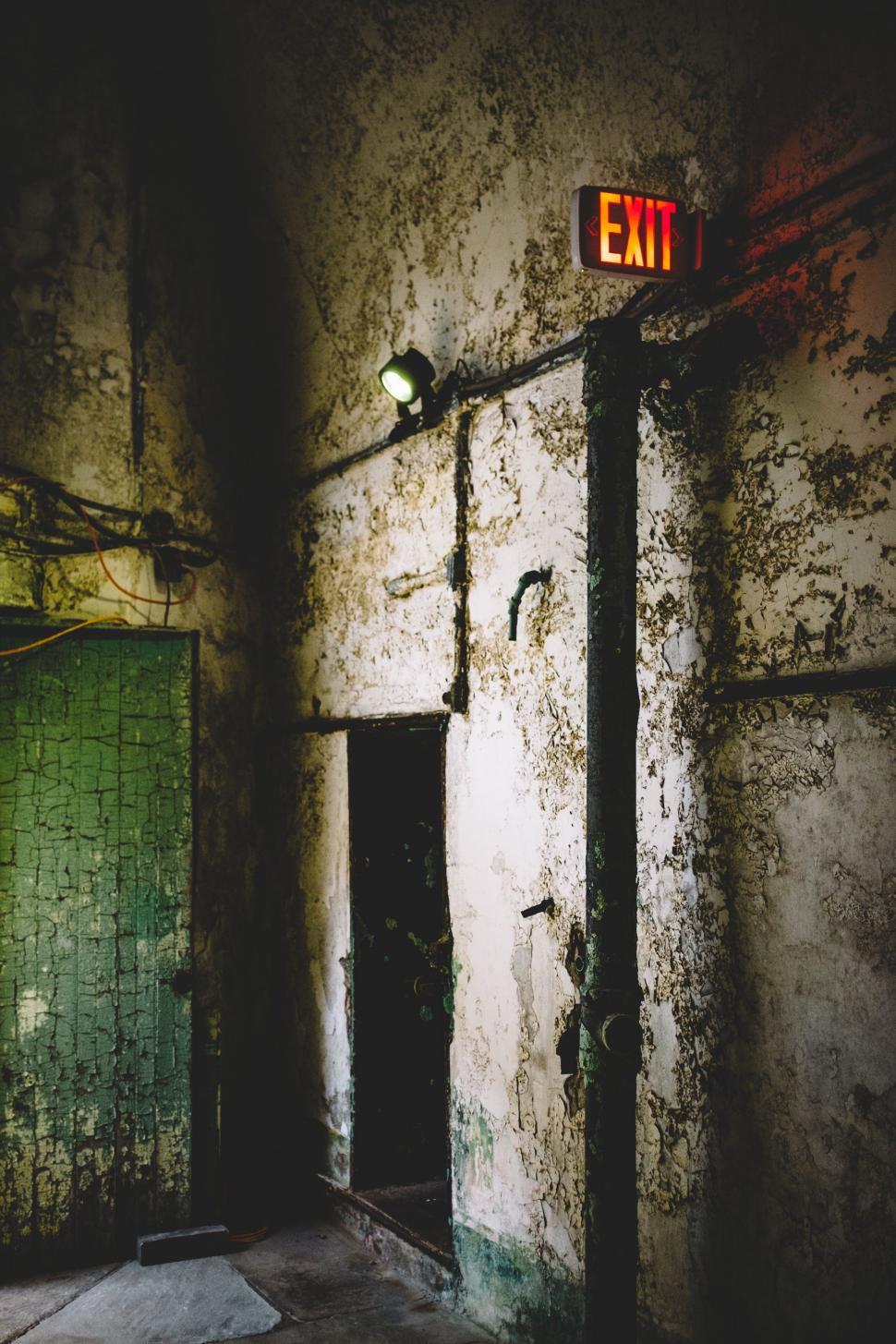 Free Image of Dark Room With Exit Sign 