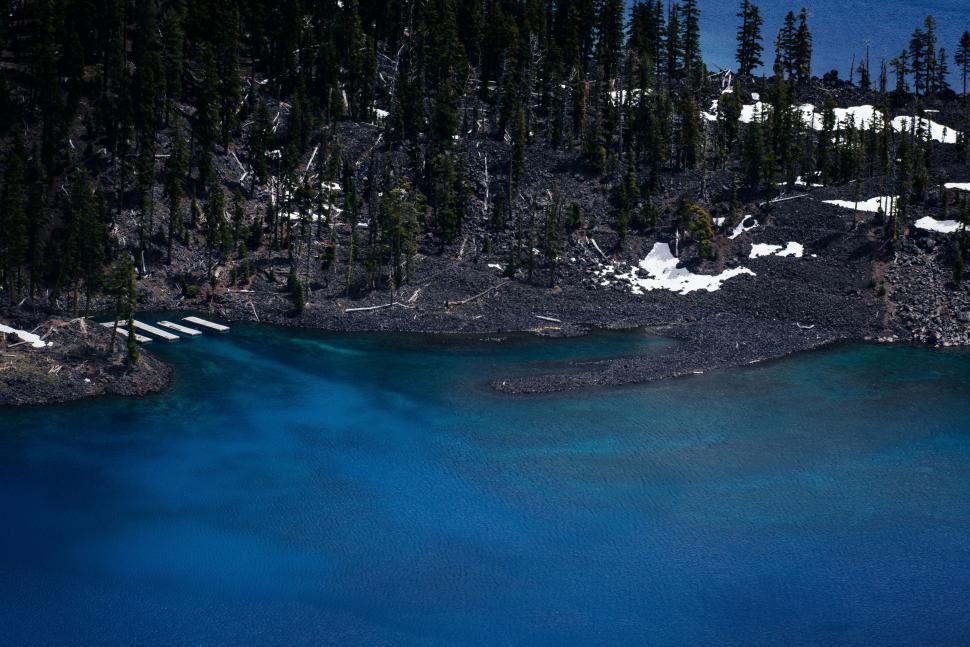Free Image of Large Body of Water Surrounded by Trees 