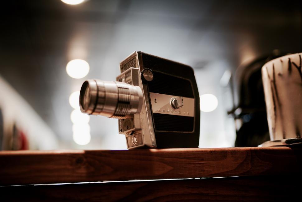 Free Image of Camera on Wooden Table 