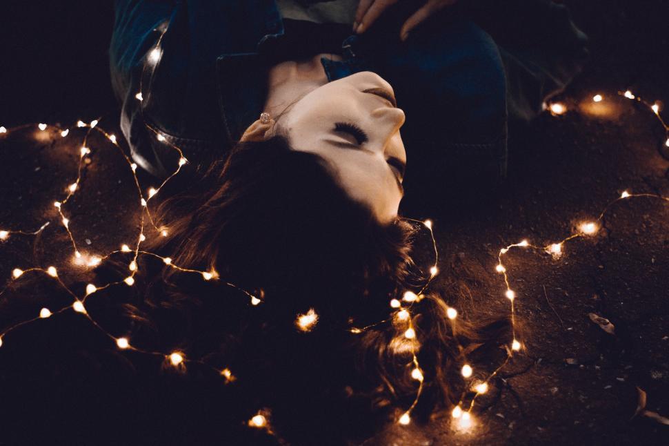 Free Image of Person Laying on Ground With Mask On 