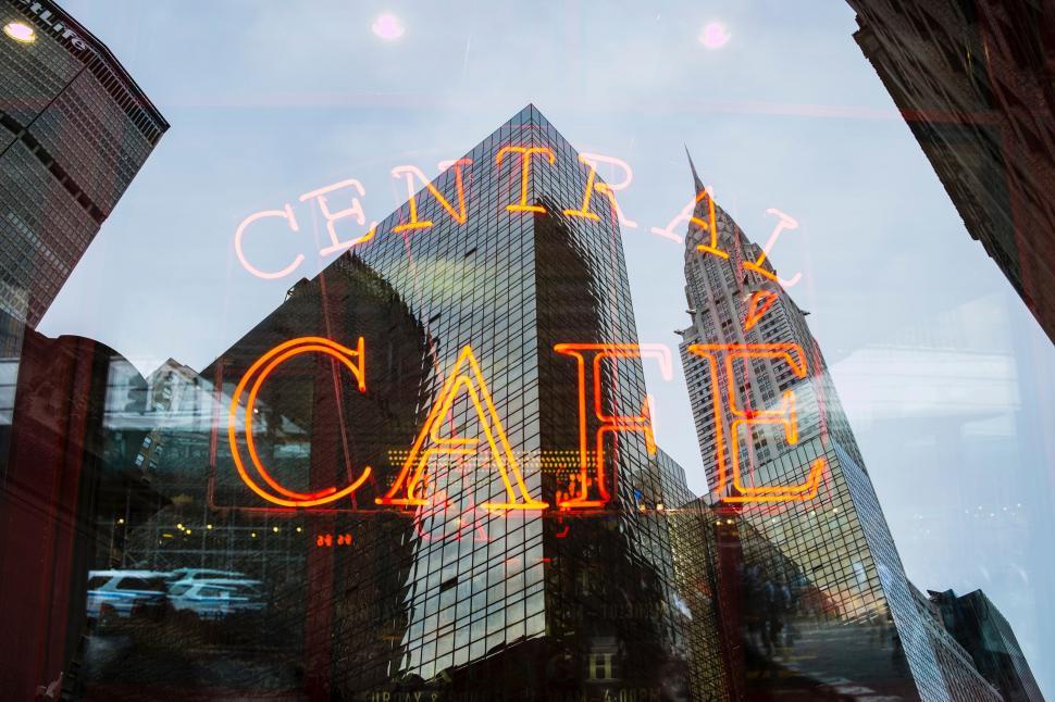 Free Image of Reflection of Building in Glass Window 