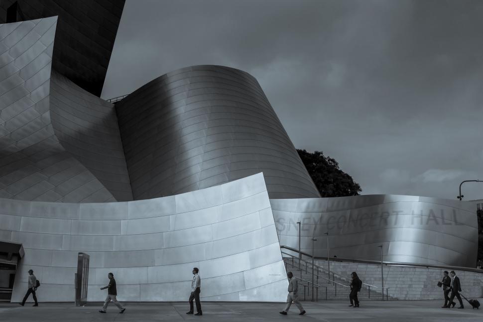 Free Image of People Walking in Front of a Building 