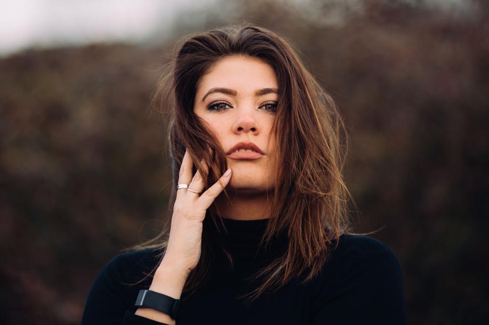 Free Image of Woman in Black Shirt Talking on Cell Phone 