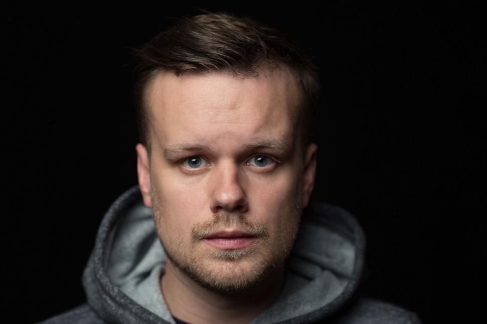 Free Image of Man in Hoodie Looking at Camera 