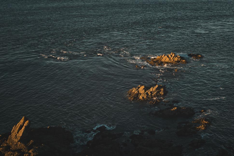 Free Image of Body of Water With Rocks 