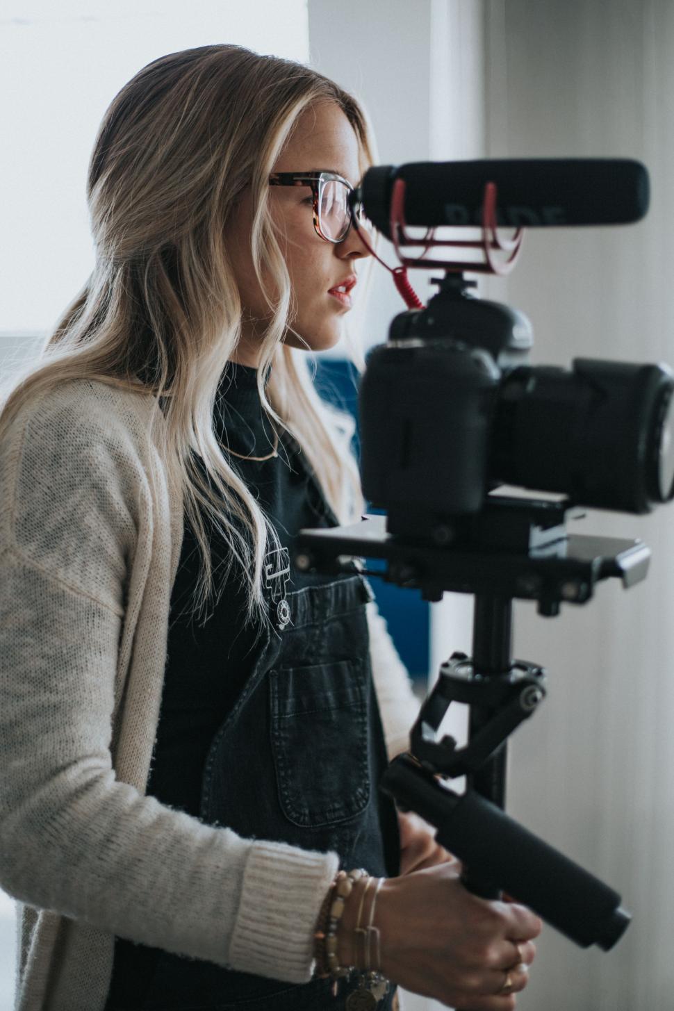 Free Image of Woman Standing in Front of Camera 