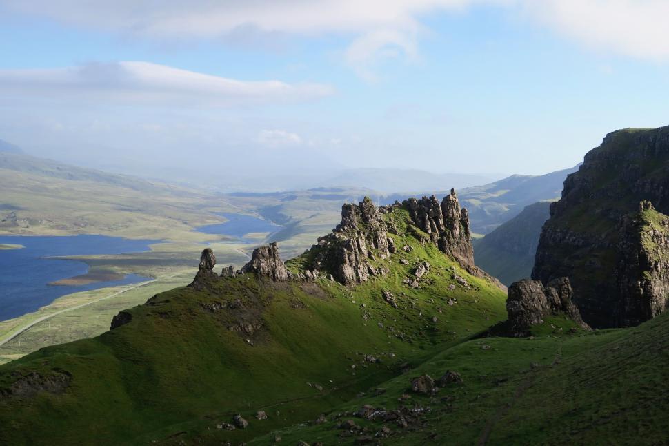 Free Image of Majestic Rocky Mountain Overlooking Distant Lake 
