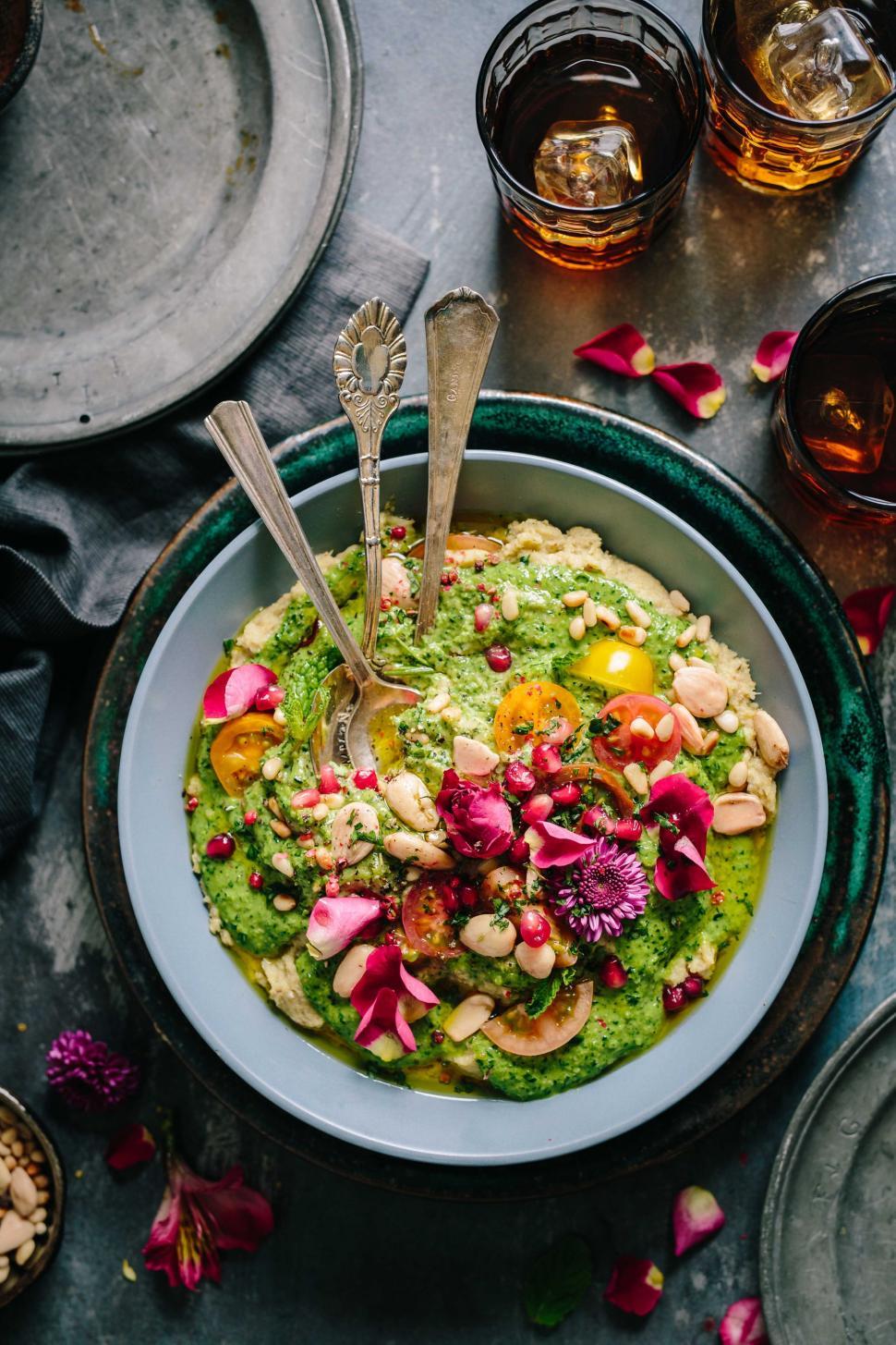 Free Image of A Bowl of Guacamole With a Spoon 