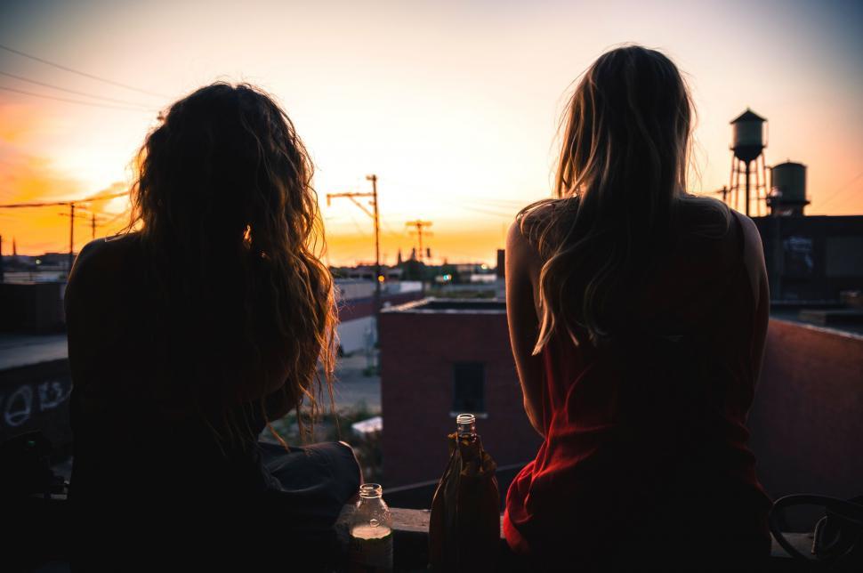 Free Image of Two Women Sitting Together 