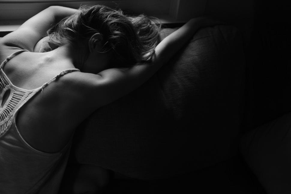 Free Image of Woman Laying on Bed 