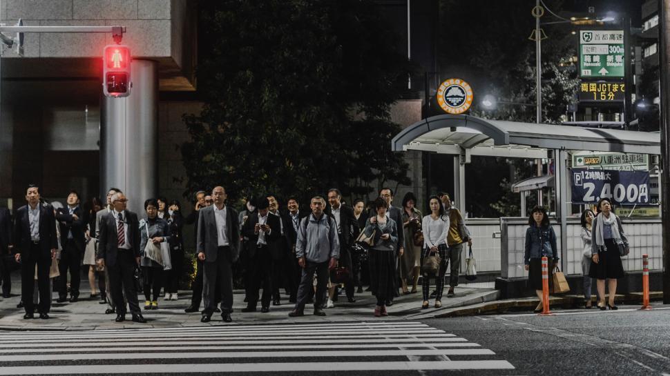 Free Image of Group of People Standing on Side of Road 