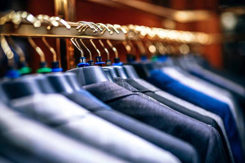 Free Image of Row of Shirts Hanging on Rack 