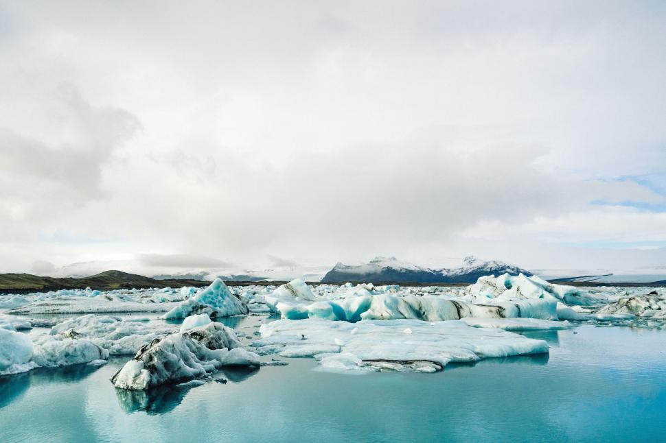 Free Image of Frozen Water Surrounding a Large Body of Water 
