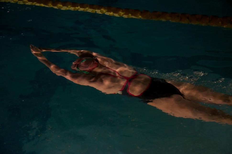 Free Image of Man Swimming in Pool Without Shirt 