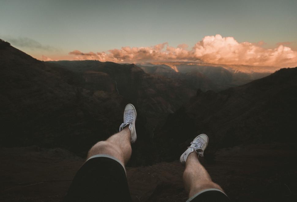 Free Image of Person Lying Down With Feet Up in the Air 