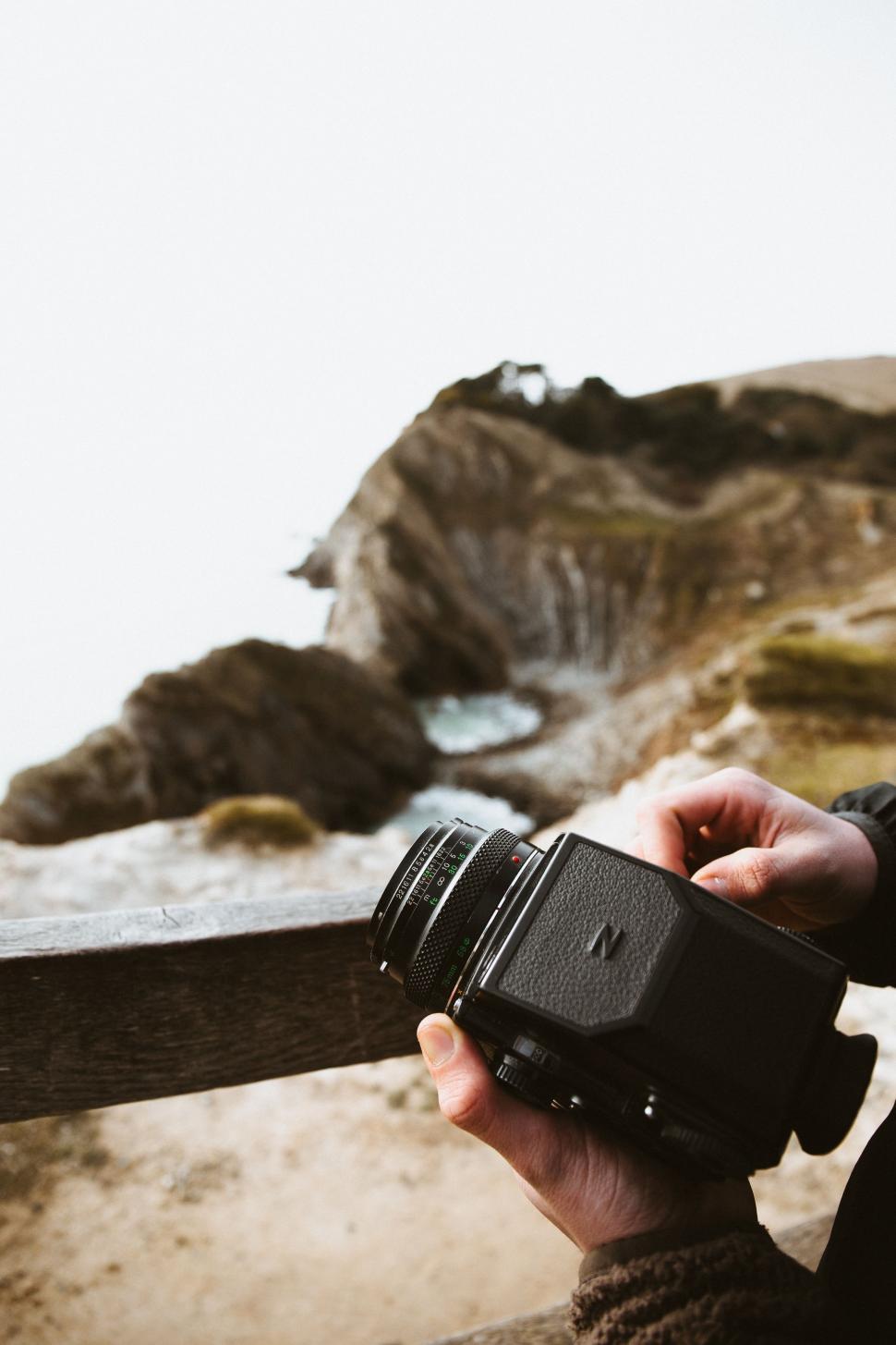 Free Image of Person Holding Camera by Water 