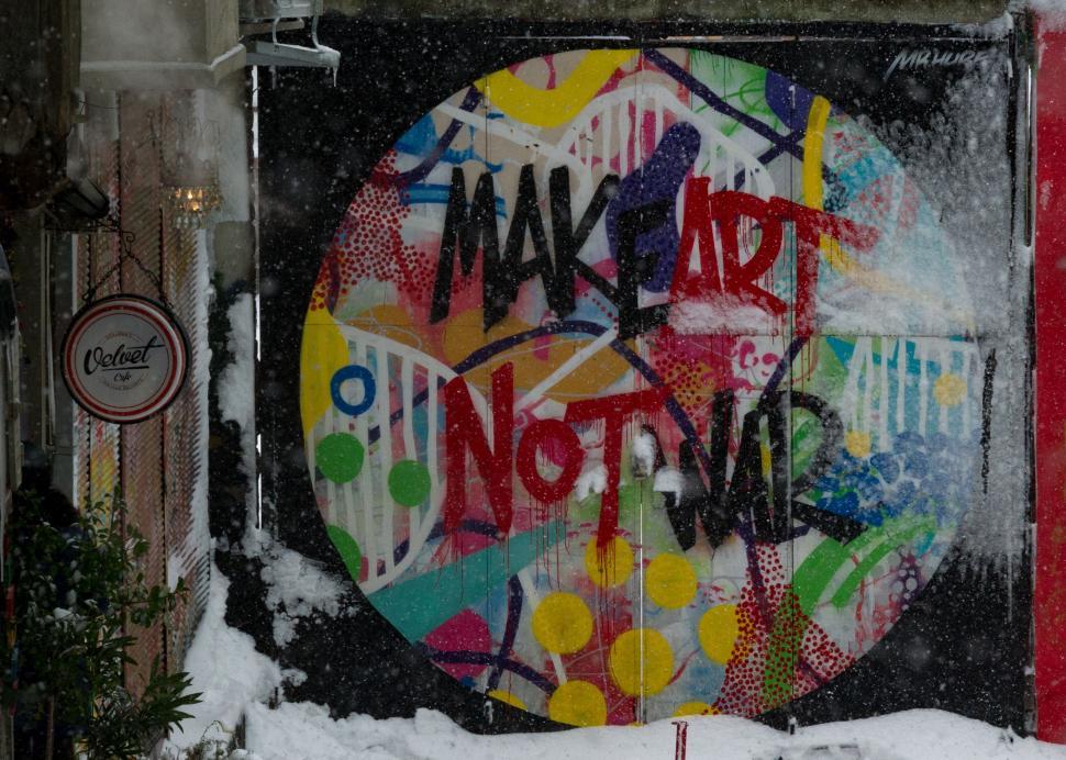 Free Image of Vibrant Graffiti Adorns Large Clock 