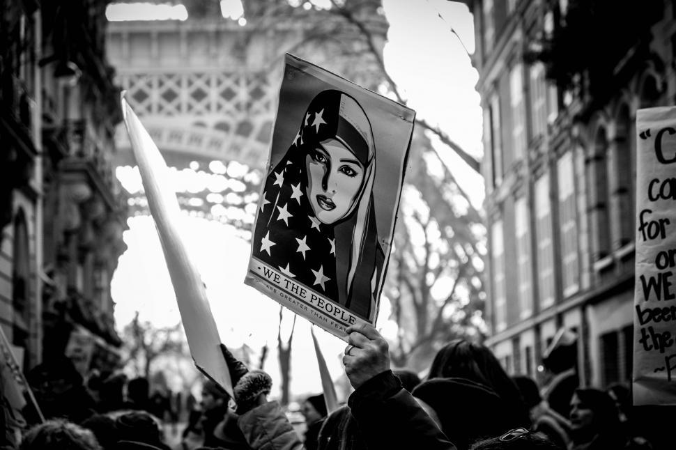 Free Image of A Crowded Gathering Holding Signs and Flags 