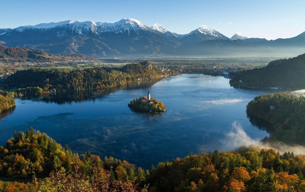 Free Image of Misty Lake Surrounded by Trees and Mountains 