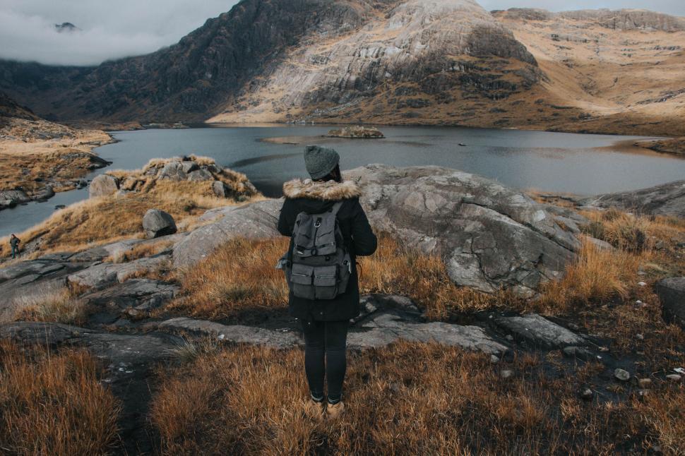 Free Image of Person Standing With Backpack on Mountain Top 