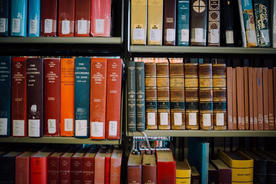Free Image of A Shelf Overflowing With Books 