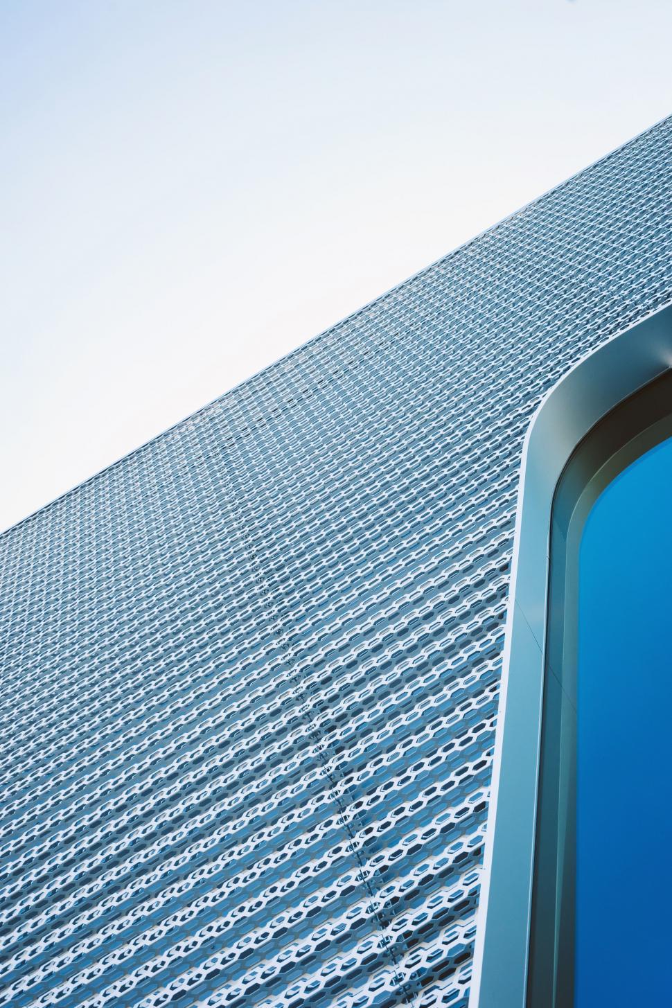 Free Image of Tall Building With Blue Sign 
