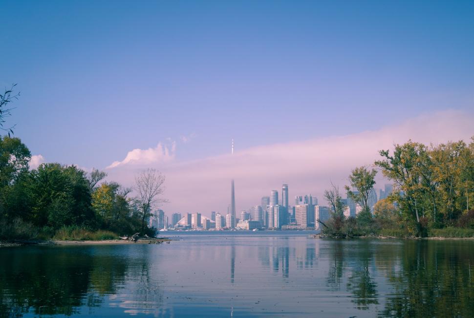 Free Image of Cityscape Across Vast Waterbody 