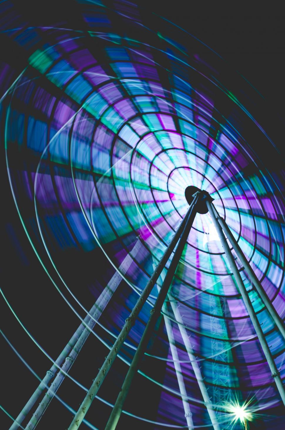 Free Image of Ferris Wheel Spinning in the Night Sky 