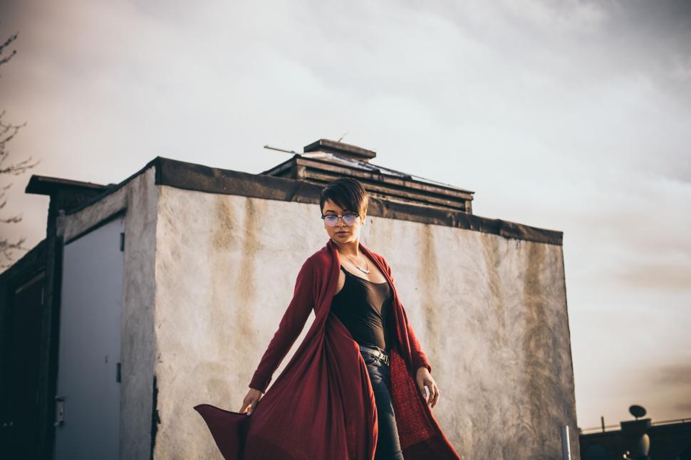 Free Image of Woman Wearing Red Coat and Black Top 
