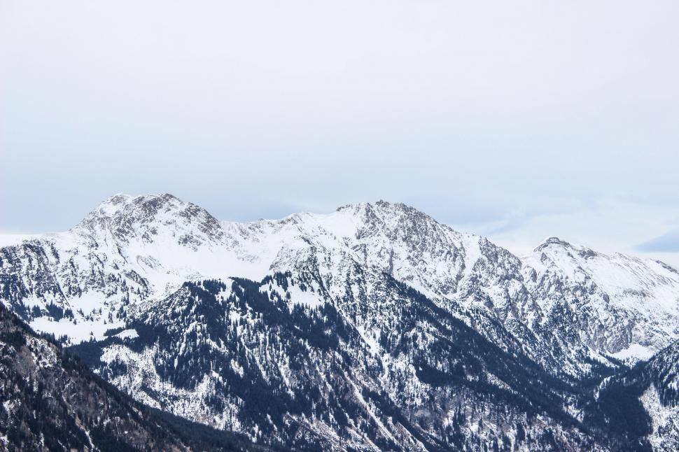 Free Image of Majestic Snow-Covered Mountain Range 